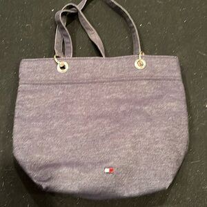 Woman’s blue Tommy Hilfiger tote bag